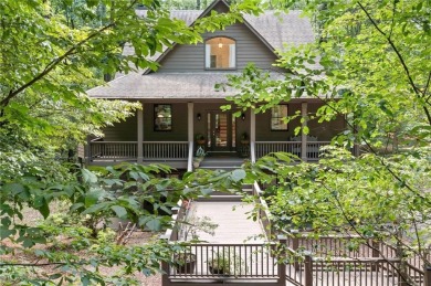 Nestled in a serene natural setting, this breathtaking 3-story on Big Canoe Golf Club - Cherokee in Georgia - for sale on GolfHomes.com, golf home, golf lot