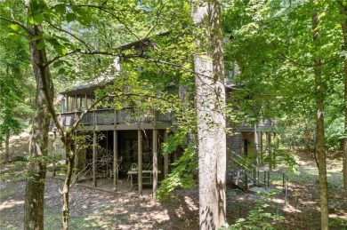 Nestled in a serene natural setting, this breathtaking 3-story on Big Canoe Golf Club - Cherokee in Georgia - for sale on GolfHomes.com, golf home, golf lot