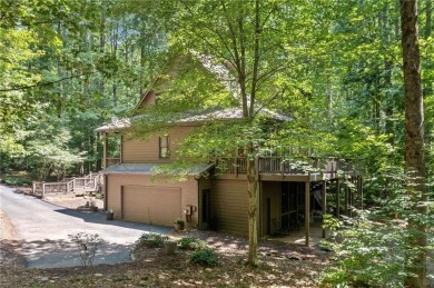Nestled in a serene natural setting, this breathtaking 3-story on Big Canoe Golf Club - Cherokee in Georgia - for sale on GolfHomes.com, golf home, golf lot
