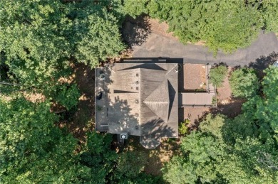 Nestled in a serene natural setting, this breathtaking 3-story on Big Canoe Golf Club - Cherokee in Georgia - for sale on GolfHomes.com, golf home, golf lot