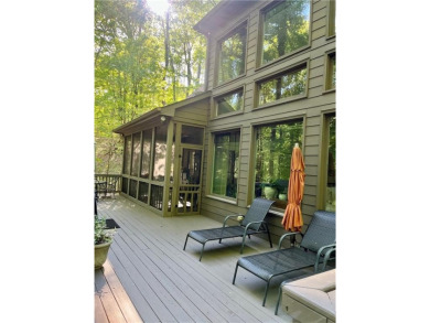 Nestled in a serene natural setting, this breathtaking 3-story on Big Canoe Golf Club - Cherokee in Georgia - for sale on GolfHomes.com, golf home, golf lot