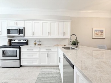 END UNIT 2 BR + DEN CONDO in Naples Heritage Golf and Country on  in Florida - for sale on GolfHomes.com, golf home, golf lot