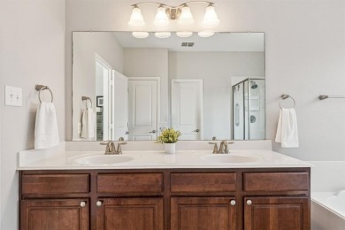 This beautiful single-story home in Hidden Cove is located just on Frisco Lakes Golf Course in Texas - for sale on GolfHomes.com, golf home, golf lot