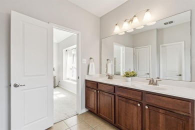 This beautiful single-story home in Hidden Cove is located just on Frisco Lakes Golf Course in Texas - for sale on GolfHomes.com, golf home, golf lot