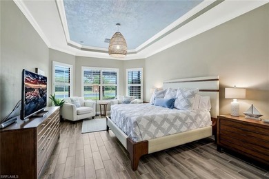 Enjoy captivating lake views from this impeccably turnkey with on The Rookery At Marco in Florida - for sale on GolfHomes.com, golf home, golf lot