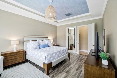 Enjoy captivating lake views from this impeccably turnkey with on The Rookery At Marco in Florida - for sale on GolfHomes.com, golf home, golf lot