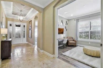 Enjoy captivating lake views from this impeccably turnkey with on The Rookery At Marco in Florida - for sale on GolfHomes.com, golf home, golf lot