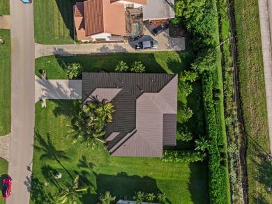 Built in 2022, this Concrete Block home with Metal Roof & Impact on Yacht and Country Club in Florida - for sale on GolfHomes.com, golf home, golf lot