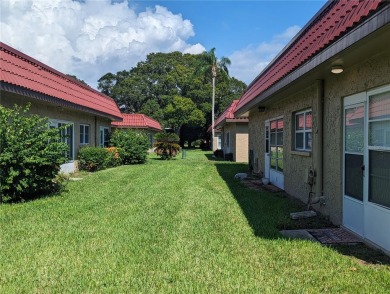 Centrally located 55+ community in popular Pinewood Village on Clearwater Executive Golf Course in Florida - for sale on GolfHomes.com, golf home, golf lot