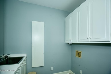 Located on a corner lot at Wilson Country Club overlooking Hole on Wilson Country Club in North Carolina - for sale on GolfHomes.com, golf home, golf lot