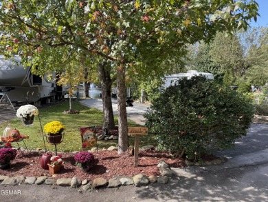 Beautifully landscaped LAKEFRONT RV lot in the sought after on Bent Creek Golf Course in Tennessee - for sale on GolfHomes.com, golf home, golf lot