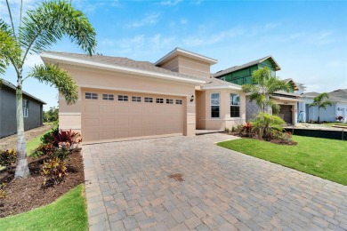 Welcome to 923 Signet Drive, a stunning 2023 masterpiece nestled on Apollo Beach Golf and Sea Club in Florida - for sale on GolfHomes.com, golf home, golf lot