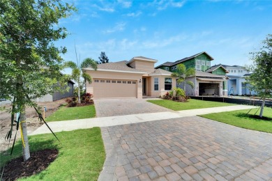 Welcome to 923 Signet Drive, a stunning 2023 masterpiece nestled on Apollo Beach Golf and Sea Club in Florida - for sale on GolfHomes.com, golf home, golf lot