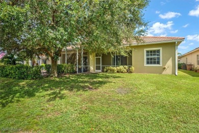 Darling Villa with screened lanai overlooking the 12th green of on Lehigh Resort Club in Florida - for sale on GolfHomes.com, golf home, golf lot