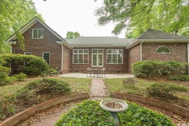 A stunning brick ranch style home with an inviting southern on Wachesaw Plantation Club in South Carolina - for sale on GolfHomes.com, golf home, golf lot