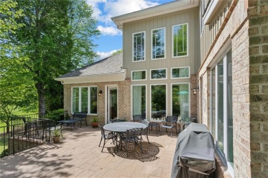 Experience elevated pond-front living at 300 Rivers Edge in on Kingsmill Resort and Golf Club in Virginia - for sale on GolfHomes.com, golf home, golf lot
