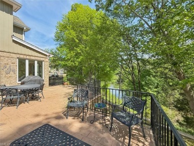 Experience elevated pond-front living at 300 Rivers Edge in on Kingsmill Resort and Golf Club in Virginia - for sale on GolfHomes.com, golf home, golf lot