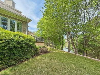 Experience elevated pond-front living at 300 Rivers Edge in on Kingsmill Resort and Golf Club in Virginia - for sale on GolfHomes.com, golf home, golf lot