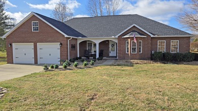 This charming one-level brick home in The Oaks of London is the on Crooked Creek Golf Club in Kentucky - for sale on GolfHomes.com, golf home, golf lot
