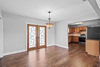 Experience serene, resort-style living in this stunning estate on Babe Zaharias Golf Course in Florida - for sale on GolfHomes.com, golf home, golf lot