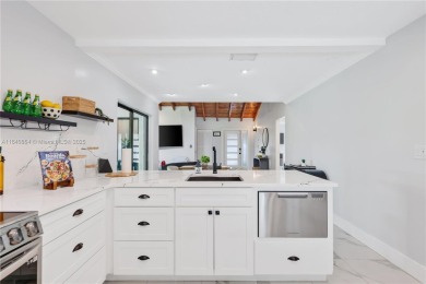Tucked behind the gates of Boca Greens, this updated 2BD/2BA on Boca Greens Country Club in Florida - for sale on GolfHomes.com, golf home, golf lot