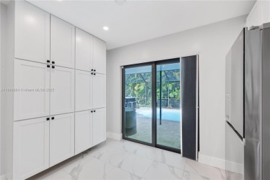 Tucked behind the gates of Boca Greens, this updated 2BD/2BA on Boca Greens Country Club in Florida - for sale on GolfHomes.com, golf home, golf lot