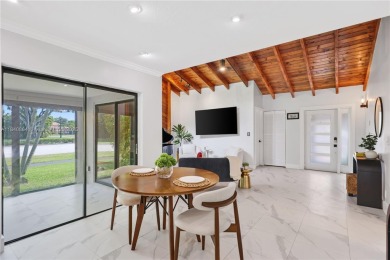 Tucked behind the gates of Boca Greens, this updated 2BD/2BA on Boca Greens Country Club in Florida - for sale on GolfHomes.com, golf home, golf lot