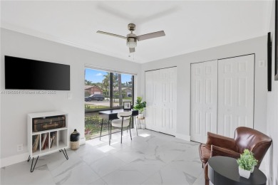Tucked behind the gates of Boca Greens, this updated 2BD/2BA on Boca Greens Country Club in Florida - for sale on GolfHomes.com, golf home, golf lot