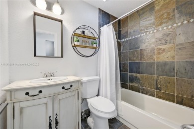 Tucked behind the gates of Boca Greens, this updated 2BD/2BA on Boca Greens Country Club in Florida - for sale on GolfHomes.com, golf home, golf lot