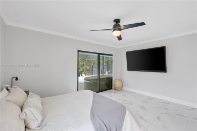 Tucked behind the gates of Boca Greens, this updated 2BD/2BA on Boca Greens Country Club in Florida - for sale on GolfHomes.com, golf home, golf lot