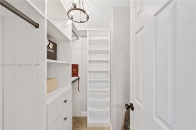 Tucked behind the gates of Boca Greens, this updated 2BD/2BA on Boca Greens Country Club in Florida - for sale on GolfHomes.com, golf home, golf lot