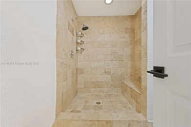 Tucked behind the gates of Boca Greens, this updated 2BD/2BA on Boca Greens Country Club in Florida - for sale on GolfHomes.com, golf home, golf lot