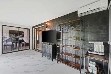 Tucked behind the gates of Boca Greens, this updated 2BD/2BA on Boca Greens Country Club in Florida - for sale on GolfHomes.com, golf home, golf lot