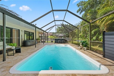 Tucked behind the gates of Boca Greens, this updated 2BD/2BA on Boca Greens Country Club in Florida - for sale on GolfHomes.com, golf home, golf lot