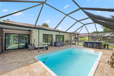 Tucked behind the gates of Boca Greens, this updated 2BD/2BA on Boca Greens Country Club in Florida - for sale on GolfHomes.com, golf home, golf lot