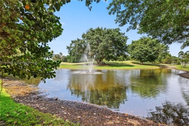 Tucked behind the gates of Boca Greens, this updated 2BD/2BA on Boca Greens Country Club in Florida - for sale on GolfHomes.com, golf home, golf lot
