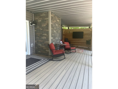 This beautifully remodeled 4 bed, 2 bath home in the Turtle Cove on Turtle Cove Golf Course in Georgia - for sale on GolfHomes.com, golf home, golf lot