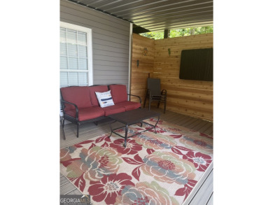 This beautifully remodeled 4 bed, 2 bath home in the Turtle Cove on Turtle Cove Golf Course in Georgia - for sale on GolfHomes.com, golf home, golf lot