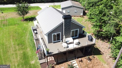 This beautifully remodeled 4 bed, 2 bath home in the Turtle Cove on Turtle Cove Golf Course in Georgia - for sale on GolfHomes.com, golf home, golf lot