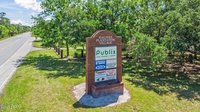 BRAND NEW ROOF - JUST INSTALLED THIS YEAR! The living is ''oh so on Halifax Plantation Golf Club in Florida - for sale on GolfHomes.com, golf home, golf lot