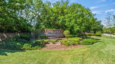 BRAND NEW ROOF - JUST INSTALLED THIS YEAR! The living is ''oh so on Halifax Plantation Golf Club in Florida - for sale on GolfHomes.com, golf home, golf lot