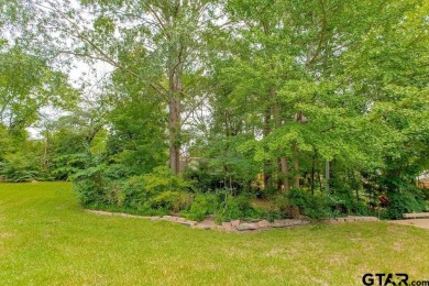 Set on a beautifully landscaped, oversized, 1 plus acre lot on Hide-A-Way Lake Golf Course in Texas - for sale on GolfHomes.com, golf home, golf lot