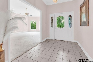 Set on a beautifully landscaped, oversized, 1 plus acre lot on Hide-A-Way Lake Golf Course in Texas - for sale on GolfHomes.com, golf home, golf lot