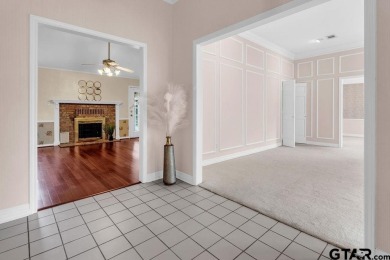 Set on a beautifully landscaped, oversized, 1 plus acre lot on Hide-A-Way Lake Golf Course in Texas - for sale on GolfHomes.com, golf home, golf lot