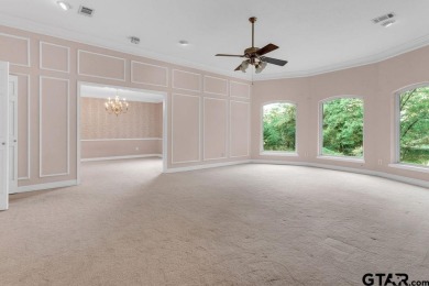 Set on a beautifully landscaped, oversized, 1 plus acre lot on Hide-A-Way Lake Golf Course in Texas - for sale on GolfHomes.com, golf home, golf lot