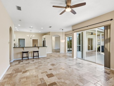 Enjoy tranquil lake views from this beautifully updated on Pelican Pointe Golf and Country Club in Florida - for sale on GolfHomes.com, golf home, golf lot