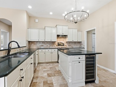 Enjoy tranquil lake views from this beautifully updated on Pelican Pointe Golf and Country Club in Florida - for sale on GolfHomes.com, golf home, golf lot