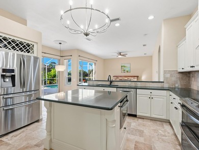 Enjoy tranquil lake views from this beautifully updated on Pelican Pointe Golf and Country Club in Florida - for sale on GolfHomes.com, golf home, golf lot