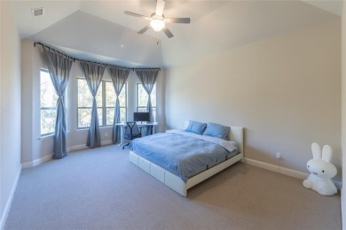 A beautifully designed 3-bedroom, 2-bathroom home by Meritage on The Tribute At the Colony in Texas - for sale on GolfHomes.com, golf home, golf lot