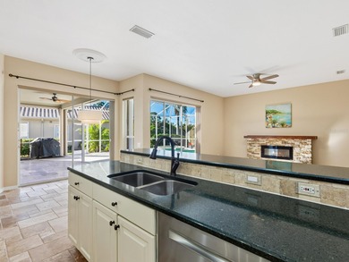 Enjoy tranquil lake views from this beautifully updated on Pelican Pointe Golf and Country Club in Florida - for sale on GolfHomes.com, golf home, golf lot